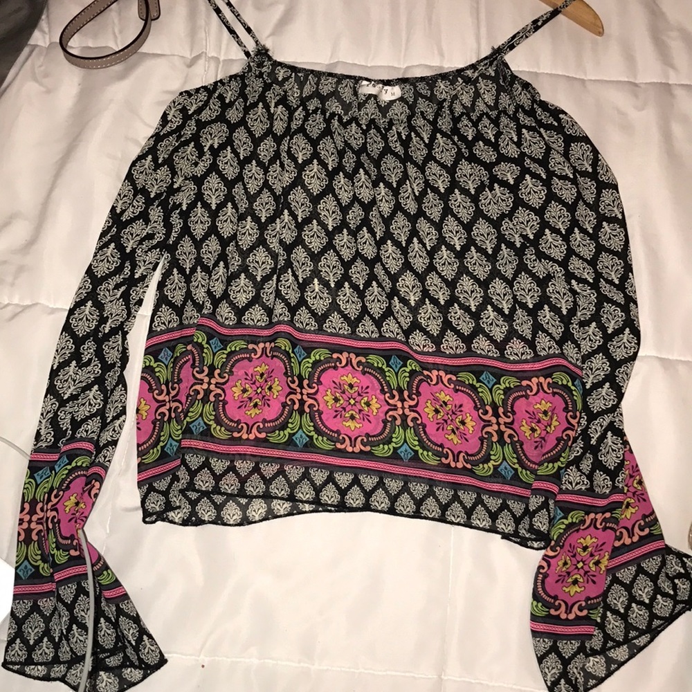 Colorful shirt on the bottom of the sleeves